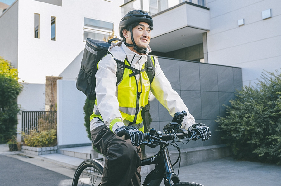 man in yellow safety vest riding his ebike
